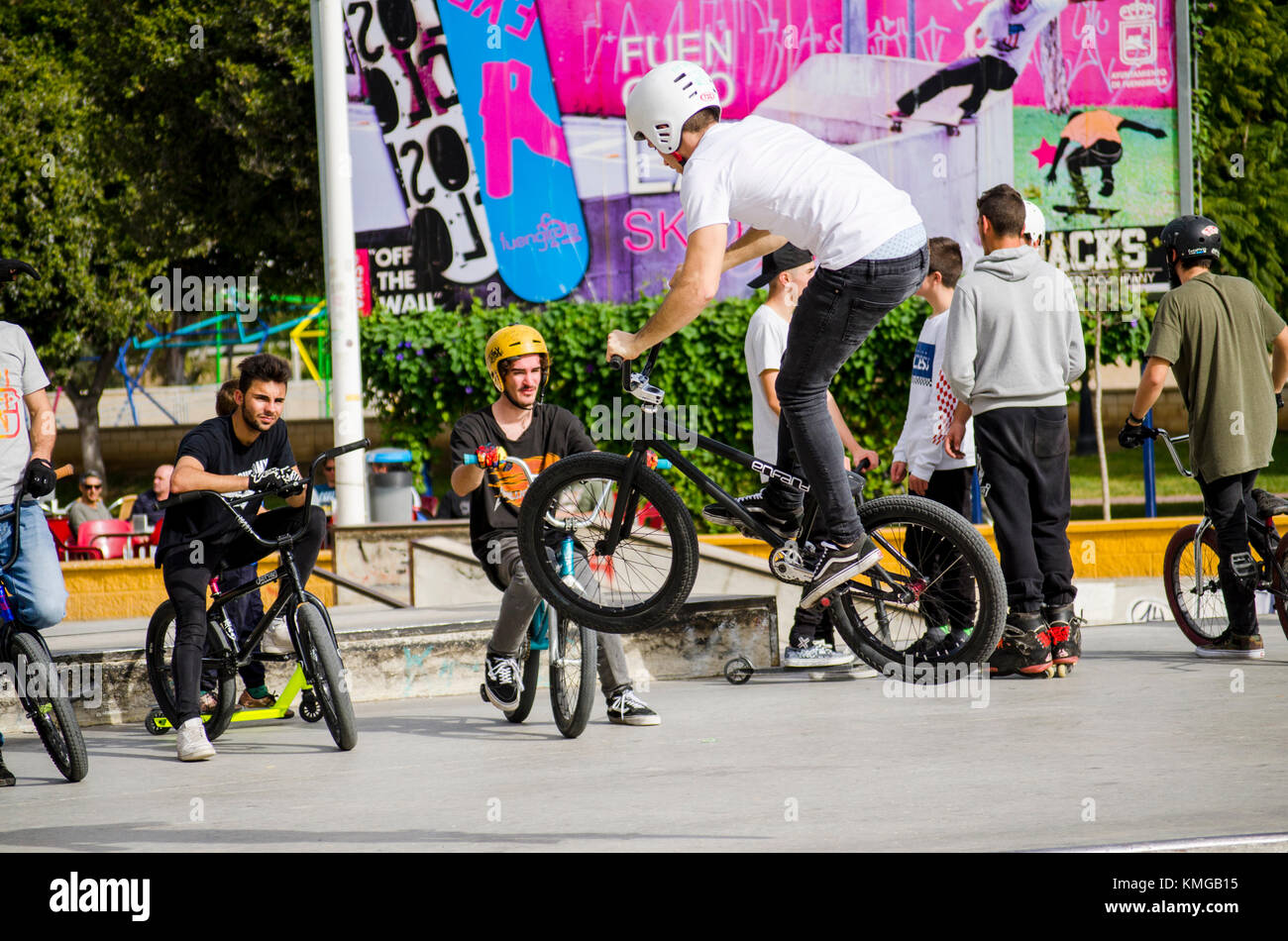 Bmx jump an riders at skate park, during freestyle competition