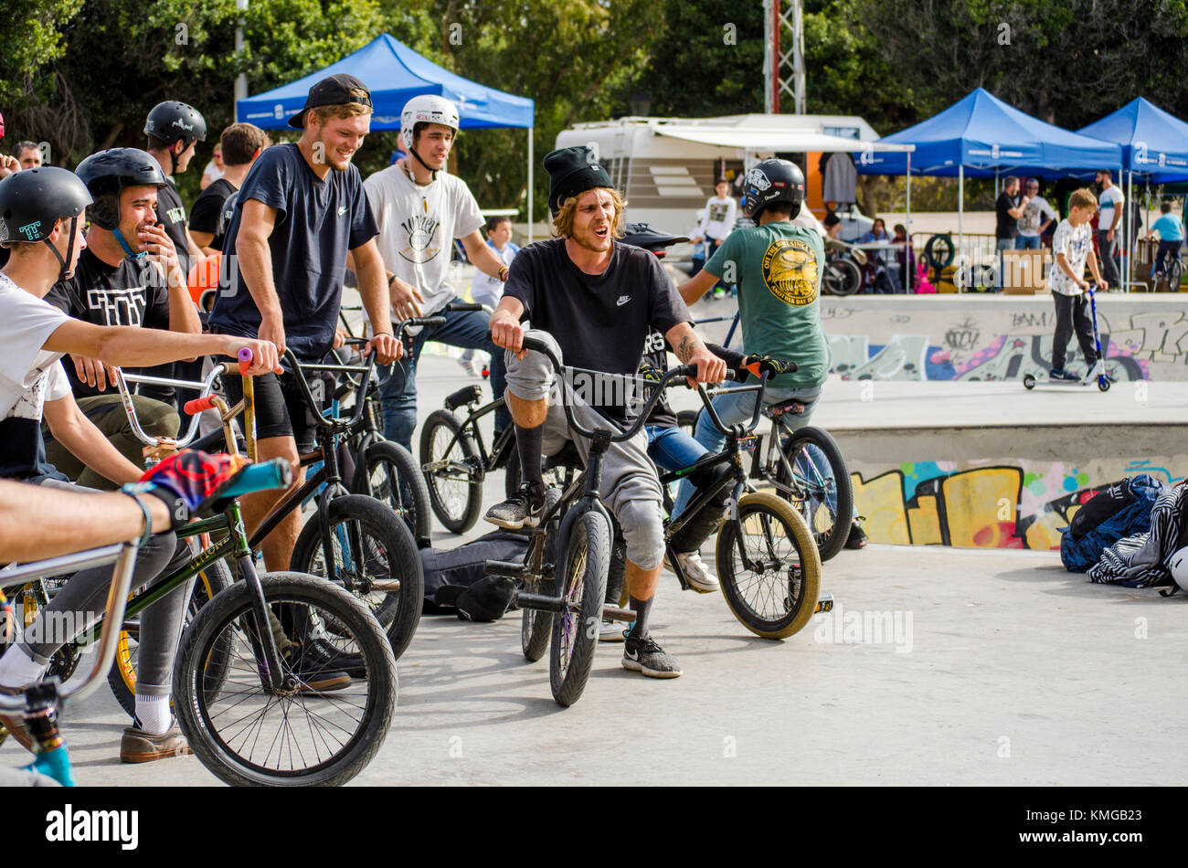 group of Bmx riders at skate park, during freestyle competition, Fuengirola, Spain. Stock Photo