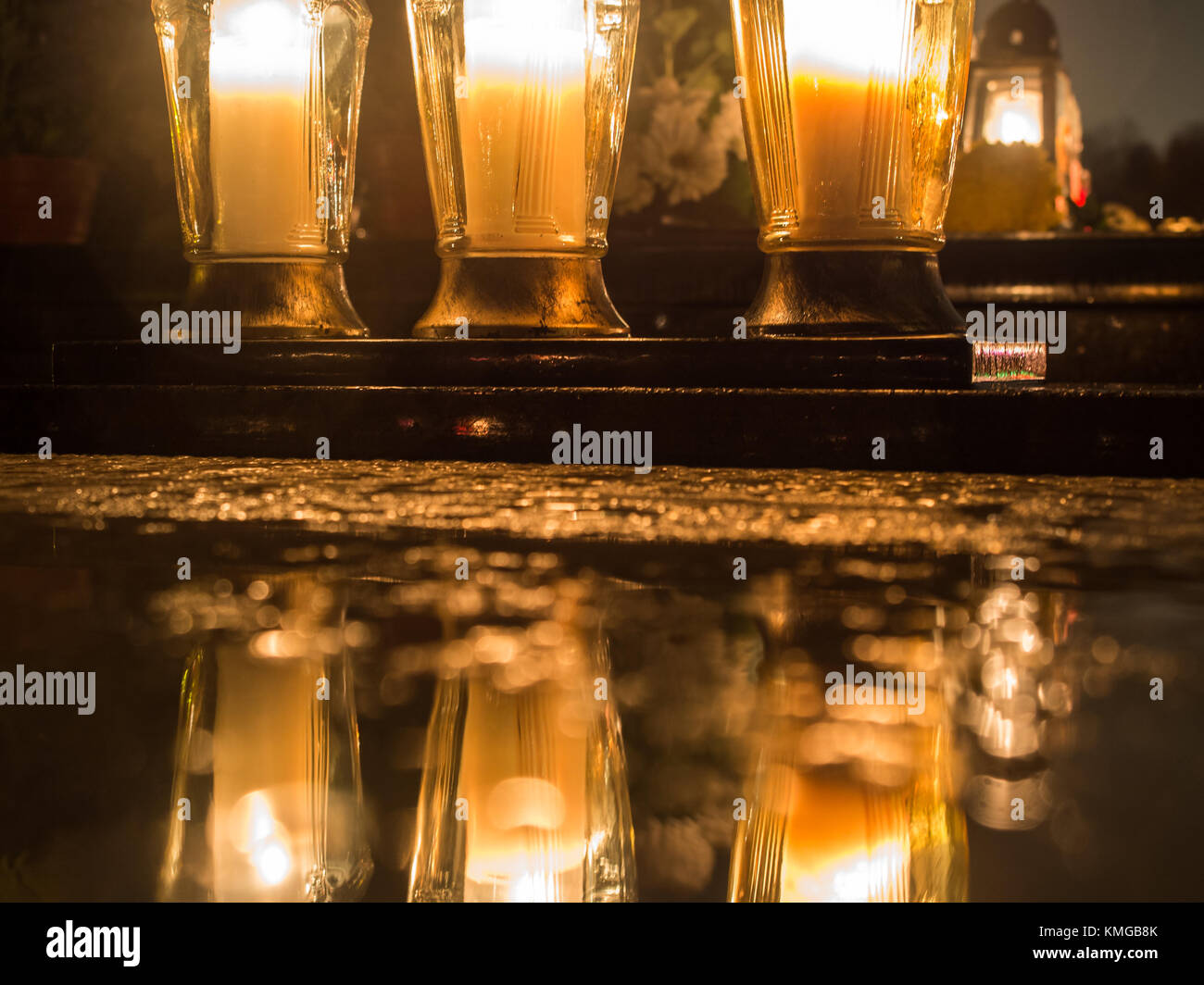 The cemetery torch burns with a bright light in the dark night Stock