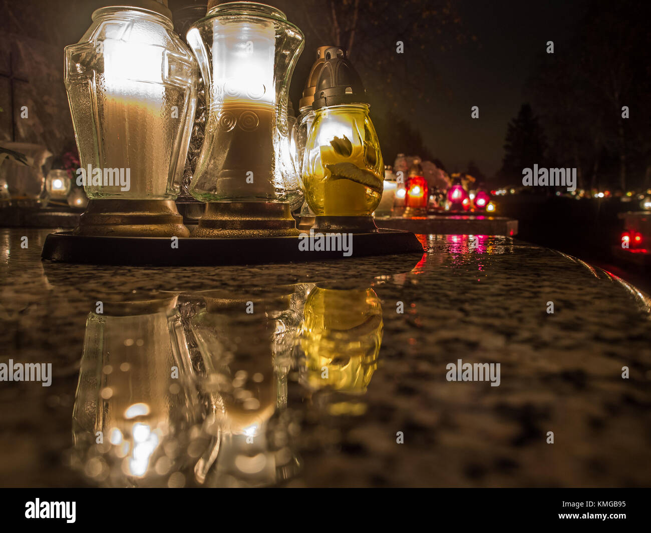 The cemetery torch burns with a bright light in the dark night Stock