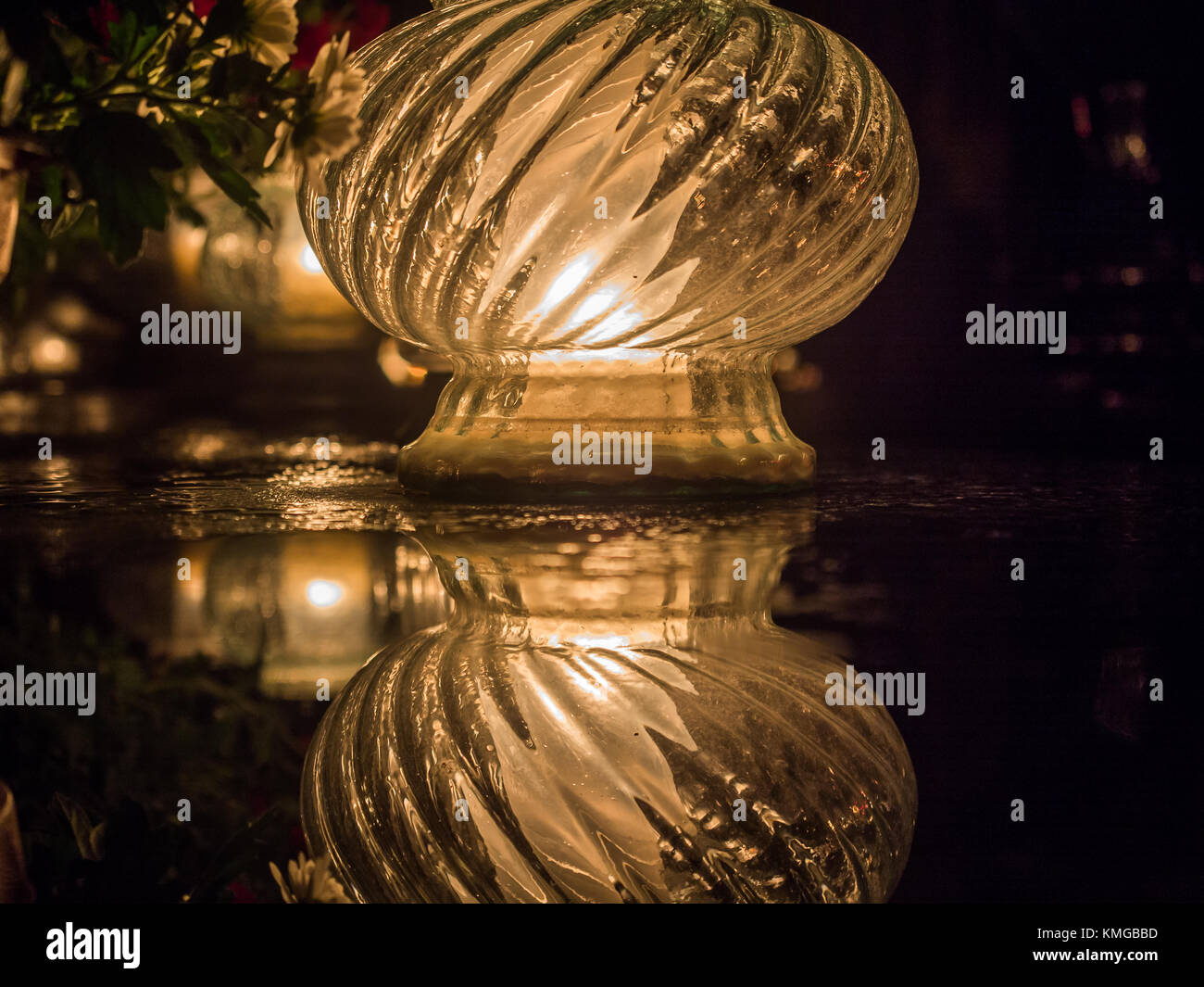 The cemetery torch burns with a bright light in the dark night Stock