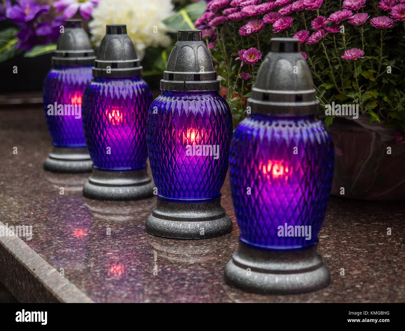 The cemetery torch burns with a bright light in the dark night Stock