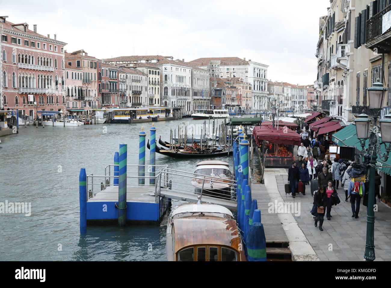 VENICE, ITALY: Gondolas and restaurants line the Grand Canal near the Ponte di Rialto bridge in Venice, Italy. Stock Photo