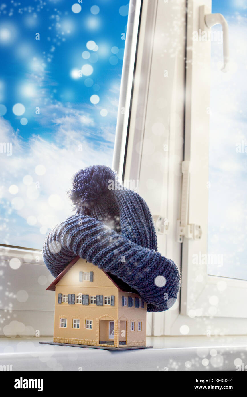 house in winter heating system concept and cold snowy weather with