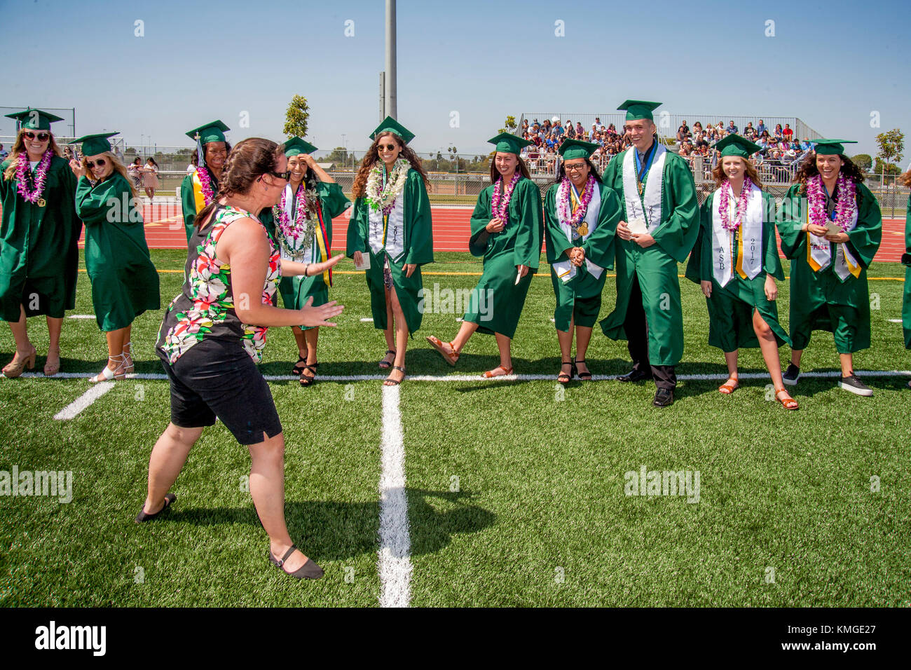 a-high-school-biology-teacher-leads-some-of-her-multiracial-graduating