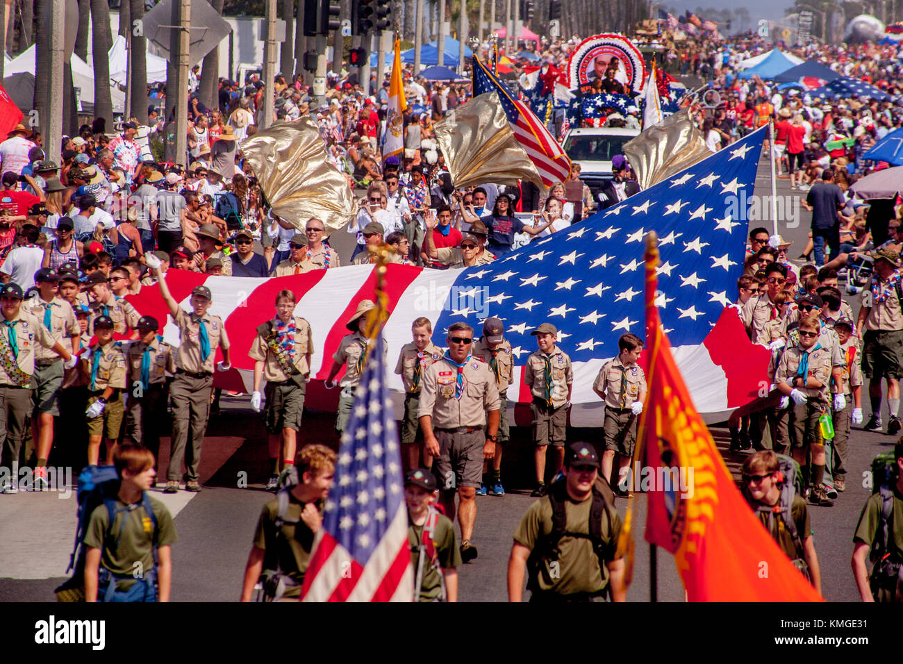 Boy Scouts march with a large US flag in a July 4th parade in Huntington  Beach, CA Stock Photo - Alamy