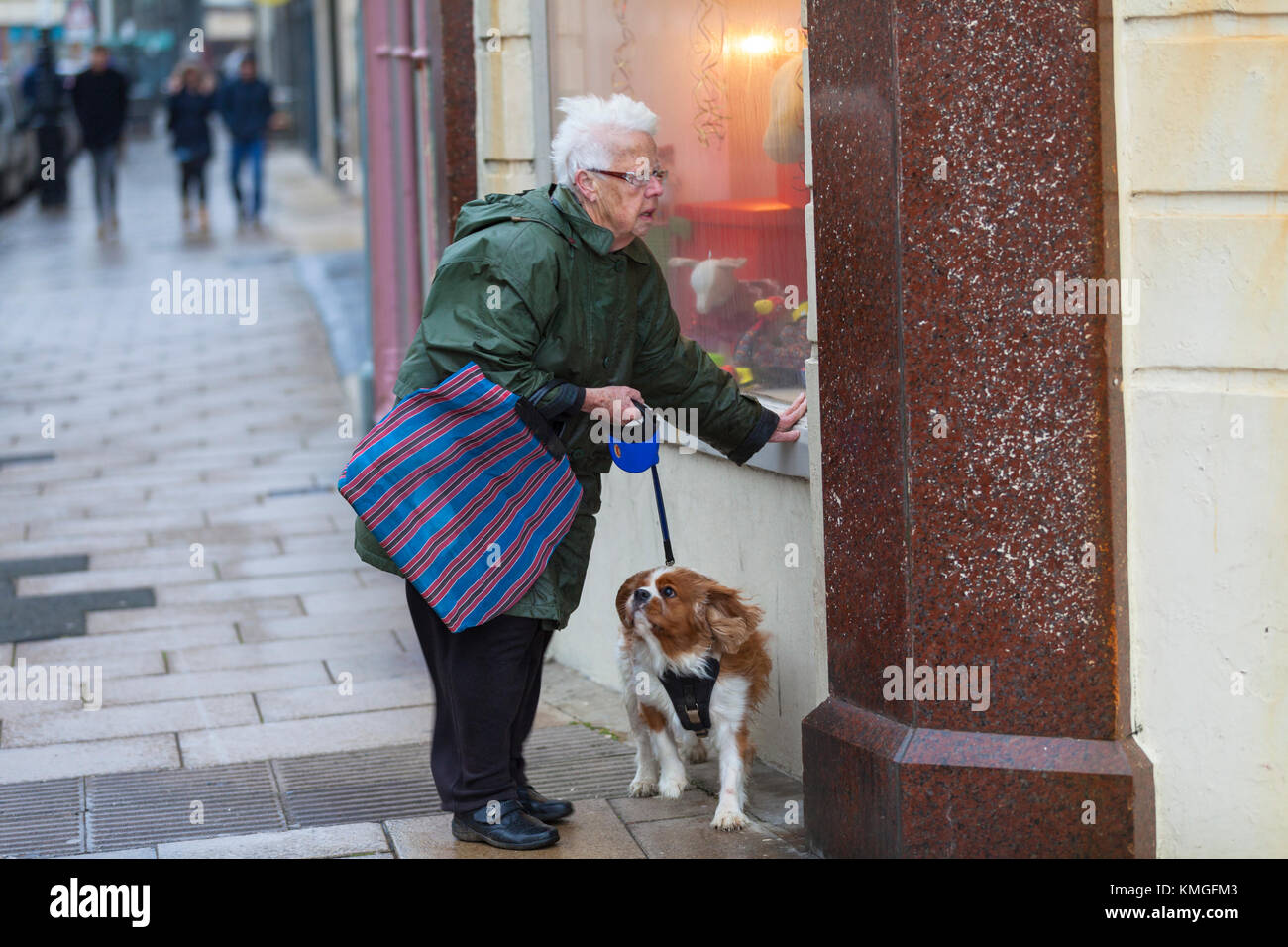 Hastings, East Sussex, UK. 7th December, 2017. Strong winds are causing problems for some people as this elderly woman struggles with the very windy weather and nearly gets knocked over. Photo Credit: Paul Lawrenson /Alamy Live News Stock Photo