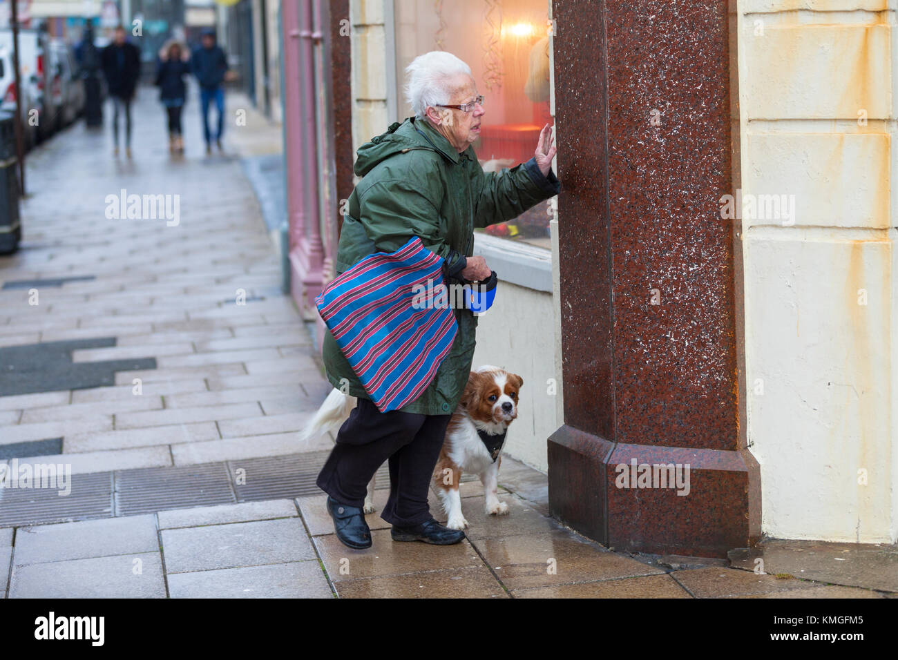 Hastings, East Sussex, UK. 7th December, 2017. Strong winds are causing problems for some people as this elderly woman struggles with the very windy weather and nearly gets knocked over. Photo Credit: Paul Lawrenson /Alamy Live News Stock Photo