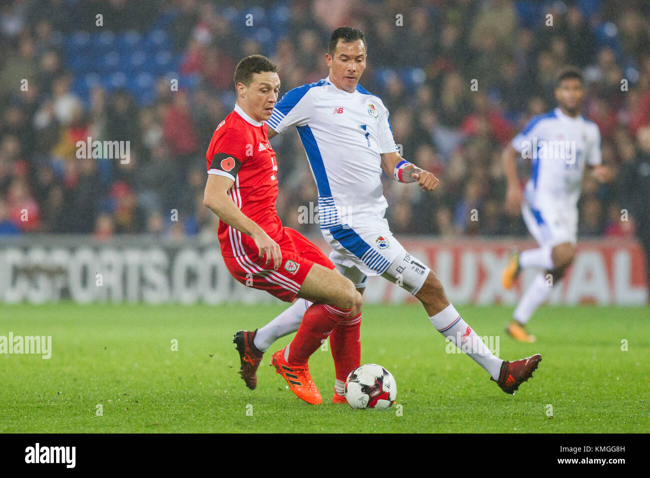Cardiff, Wales, UK, 14th November 2017: James Chester of Wales shields the ball from Blas Perez of Panama during an International friendly match between Wales and Panama at Cardiff City Stadium. Stock Photo