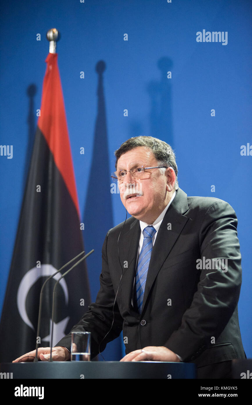 Berlin, Germany. 7th Dec, 2017. Visiting Libyan UN-backed Prime Minister Fayez al-Sarraj addresses a press conference with German Chancellor Angela Merkel (not in the picture) in Berlin, Germany, on Dec. 7, 2017. Merkel, after talks with Fayez al-Sarraj on Thursday, urged the Libyan authorities to improve the conditions of migrants in the North African country and pledged more support from the European Union. Credit: Zhang Yuan/Xinhua/Alamy Live News Stock Photo