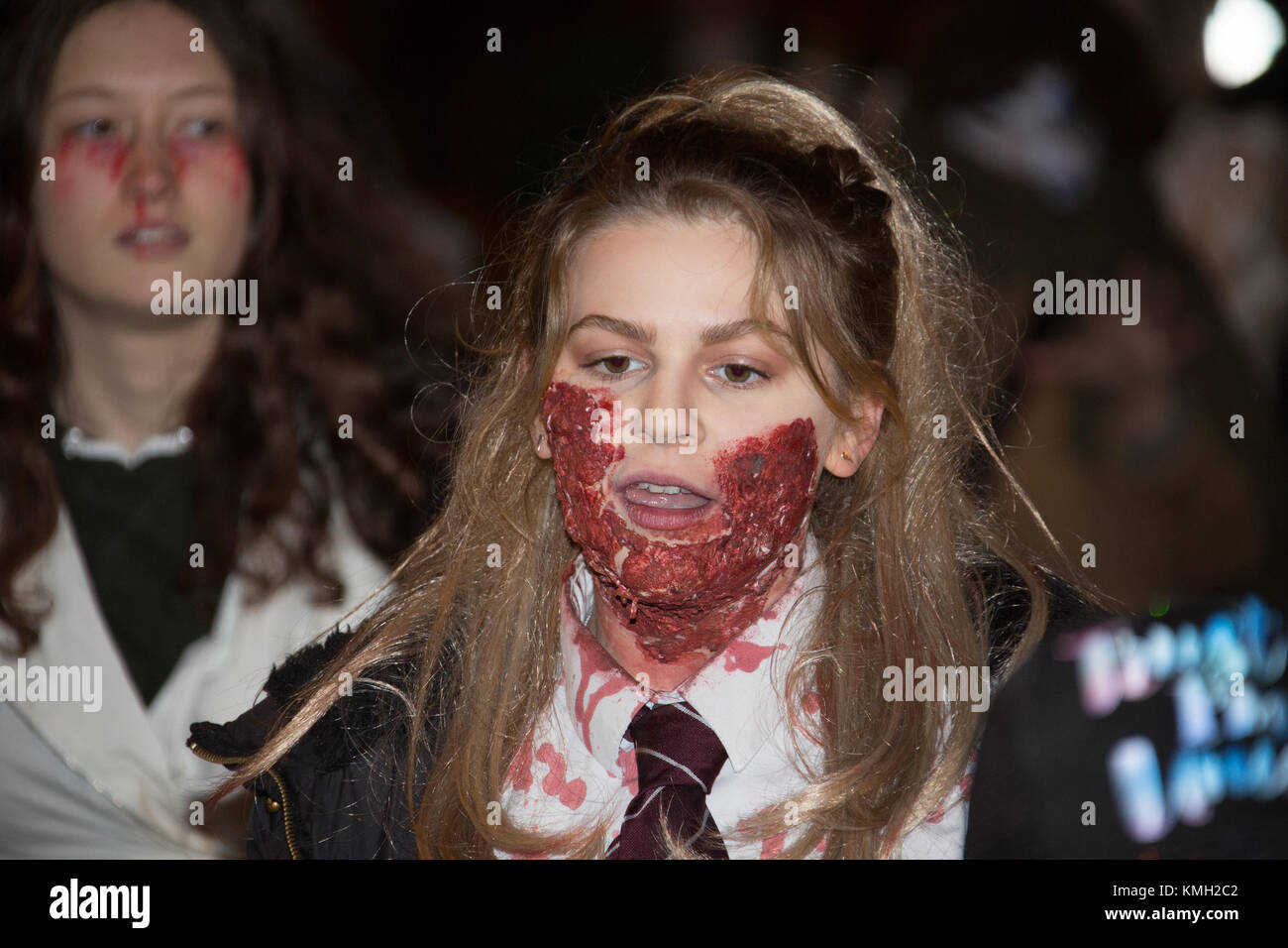 Glastonbury, UK, Saturday 9th December 2017 and as darkness settles, zombies gather for the Glastonbury Zombie Walk. Credit: Living Levels Photography/Alamy Live News Stock Photo