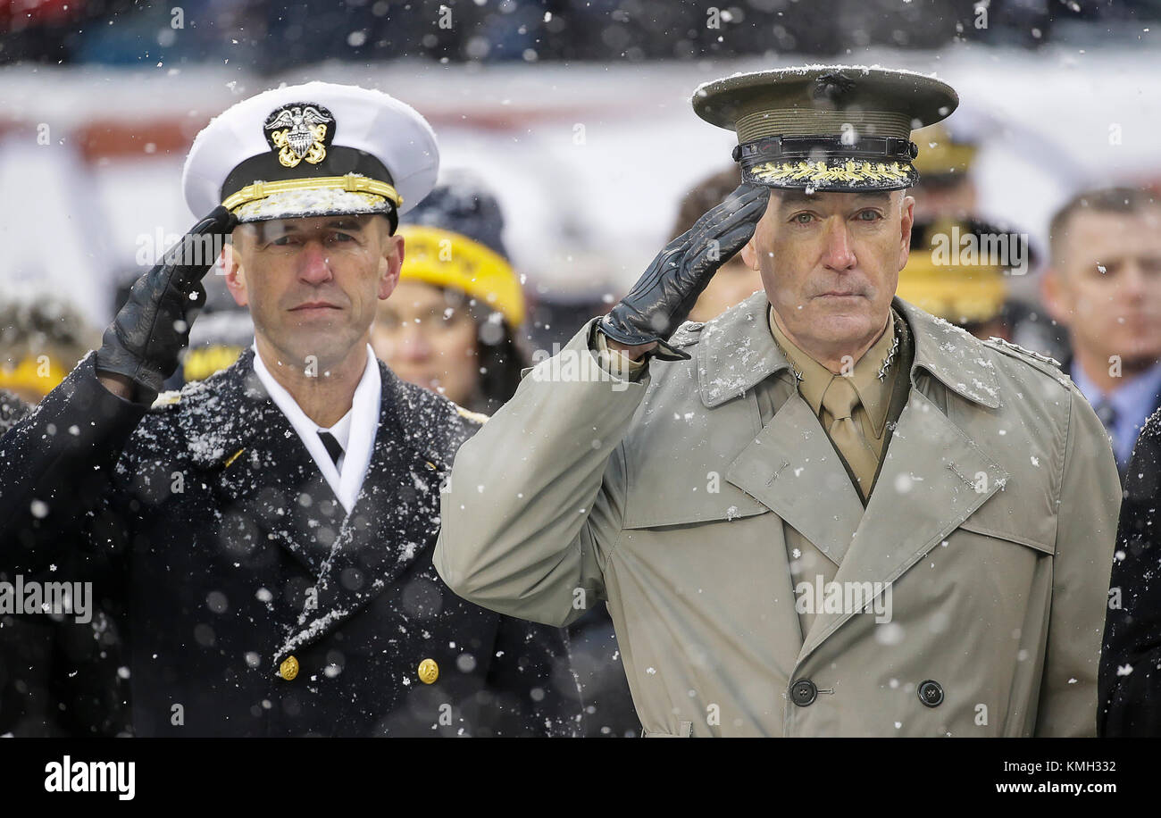 Philadelphia, Pennsylvania, USA. 9th Dec, 2017. Chairman of the Joint Chiefs of Staff, General Joseph Dunford, and Chief of Naval Operations, Admiral John Richardson, salute the flag during the National Anthem before the 118th Army Navy game between the United States Naval Academy Midshipmen and the United States Military Academy Cadets at Lincoln Financial Field in Philadelphia, Pennsylvania. Justin Cooper/CSM/Alamy Live News Stock Photo