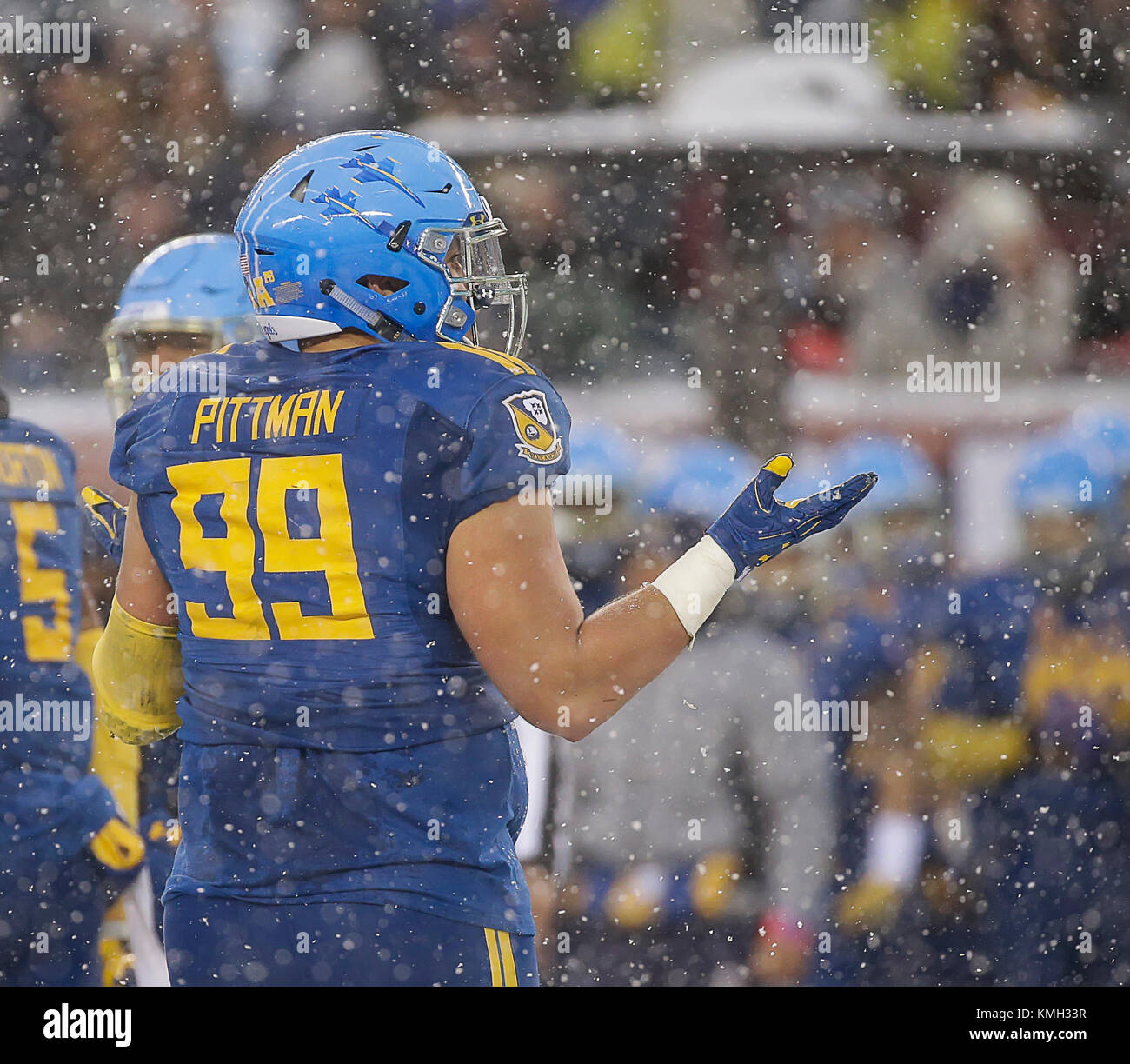 Philadelphia, Pennsylvania, USA. 9th Dec, 2017. Navy NG #99 Jackson Pittman motions to the brigade of midshipmen during the 118th Army Navy game between the United States Naval Academy Midshipmen and the United States Military Academy Cadets at Lincoln Financial Field in Philadelphia, Pennsylvania. Justin Cooper/CSM/Alamy Live News Stock Photo