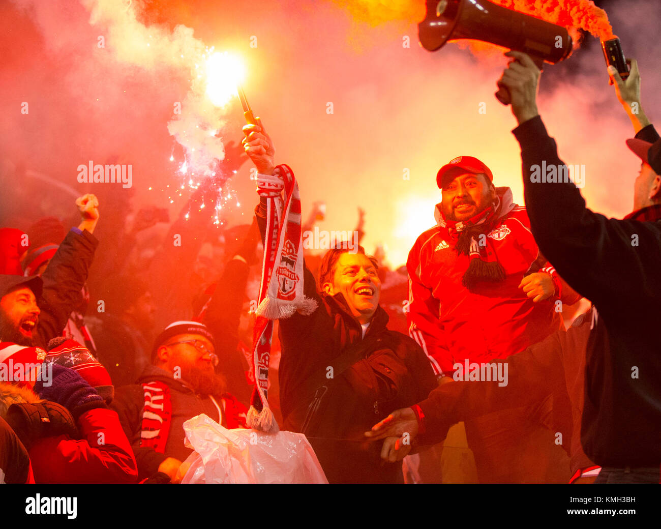 Toronto, Canada. 9th Dec, 2017. Fans of Toronto FC celebrate scoring during the 2017 Major League Soccer(MLS) Cup final between Toronto FC and Seattle Sounders FC at BMO Field in Toronto, Canada, Dec. 9, 2017. Toronto FC won 2-0 and claimed the title. Credit: Zou Zheng/Xinhua/Alamy Live News Stock Photo