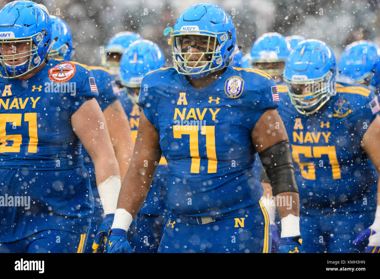 Philadelphia, PA, USA. 09th Dec, 2017. Navy Midshipmen guard Evan Martin (71) and Navy Midshipmen offensive tackle Andrew Wood (61) look on through the snow during the 118th edition of The Army-Navy game between The Army Black Knights and The Navy Midshipmen at Lincoln Financial Field in Philadelphia, PA. The Army Black Knights defeat The Navy Midshipmen 14-13. Mandatory Credit: Kostas Lymperopoulos/CSM, Credit: csm/Alamy Live News Stock Photo