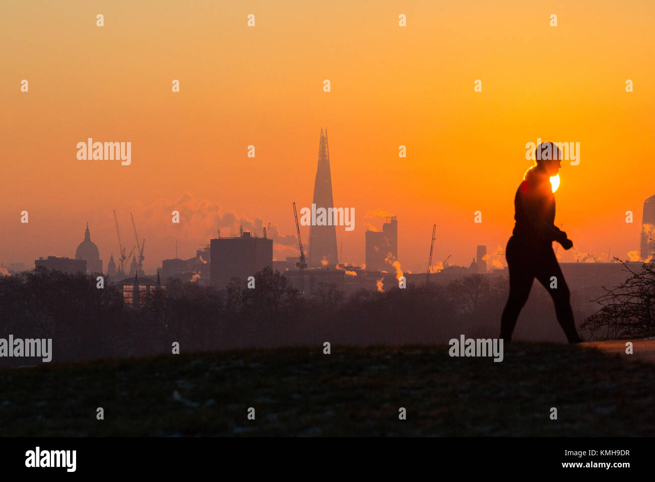 London, UK. 12th Dec, 2017. London, December 12 2017. The sun rises on a clear very cold morning in London, seen from Primrose Hill in Camden. Credit: Paul Davey/Alamy Live News Stock Photo