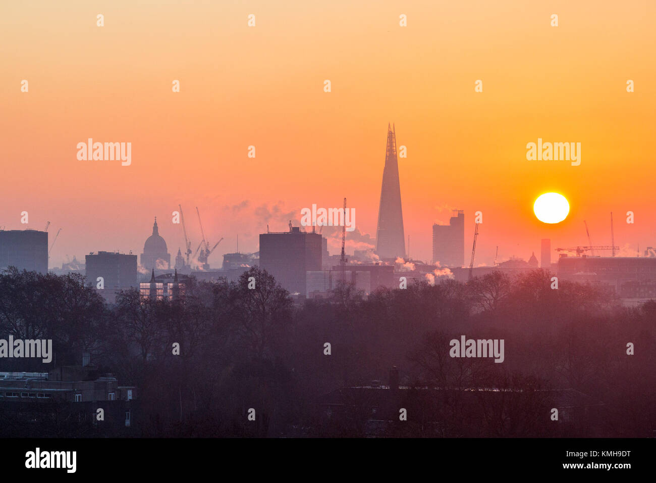 London, UK. 12th Dec, 2017. London, December 12 2017. Steam rises from buildings as the sun rises on a clear very cold morning in London, seen from Primrose Hill in Camden. Credit: Paul Davey/Alamy Live News Stock Photo