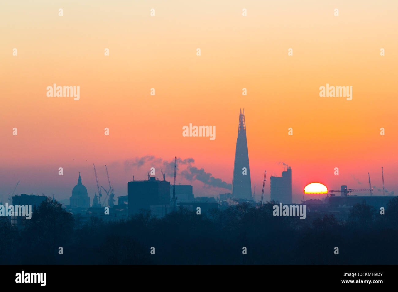 London, UK. 12th Dec, 2017. London, December 12 2017. The sun rises on a clear very cold morning in London, seen from Primrose Hill in Camden. Credit: Paul Davey/Alamy Live News Stock Photo