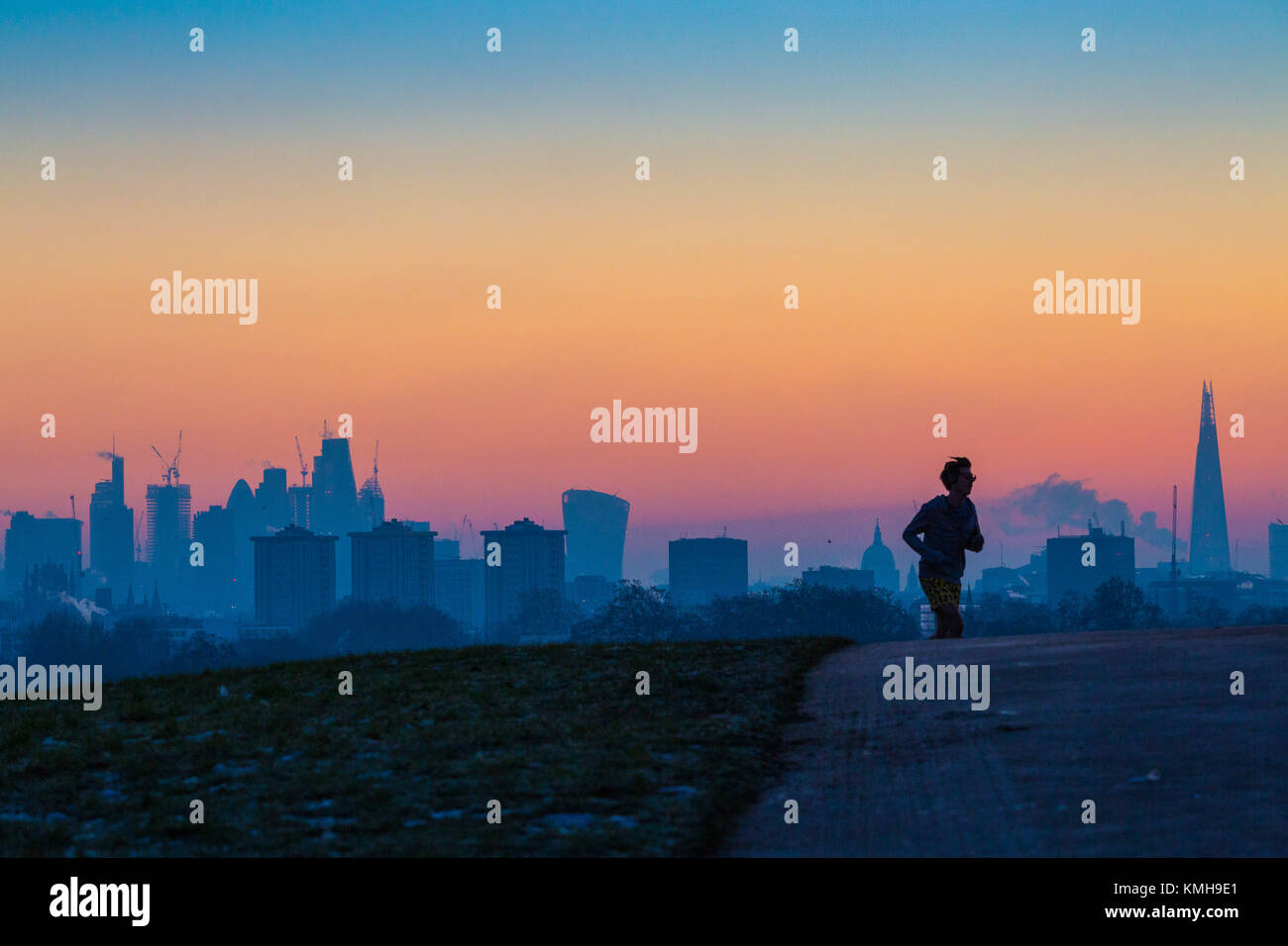 London, UK. 12th Dec, 2017. London, December 12 2017. A runner reaches the top of Primrose Hill mites before the sunrise on a clear very cold morning in London. Credit: Paul Davey/Alamy Live News Stock Photo