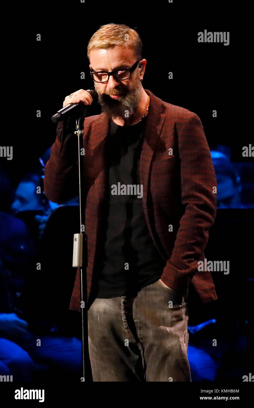 Rome, Italy - 11 December 2017: Marco Masini sings on the stage of the Auditorium Parco della Musica, on the occasion of the concert of the State Police Band, 'Being there always, with music and words'. Stock Photo