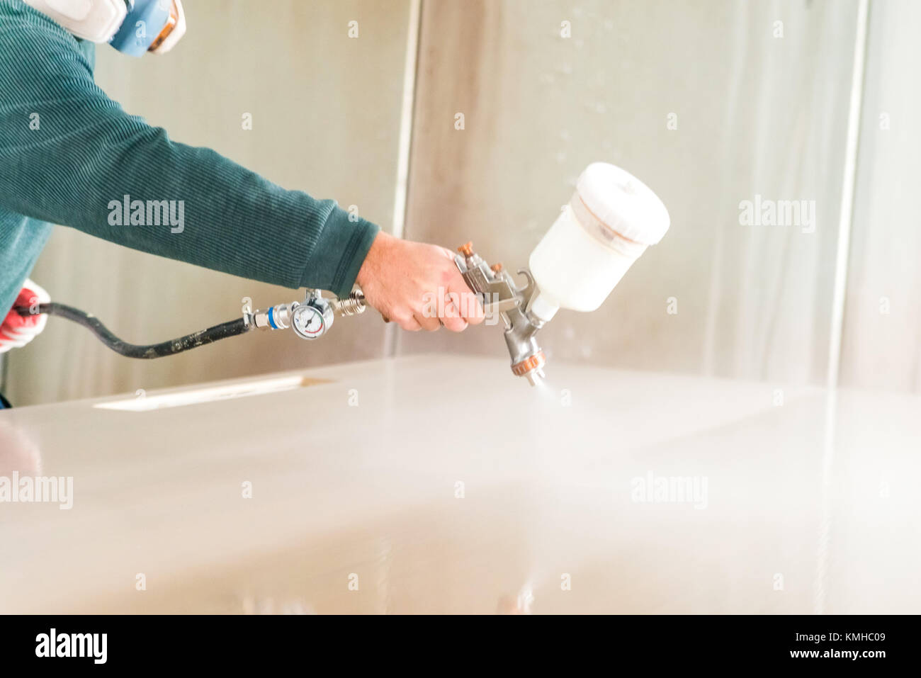Staining wood with spray gun Stock Photo Alamy