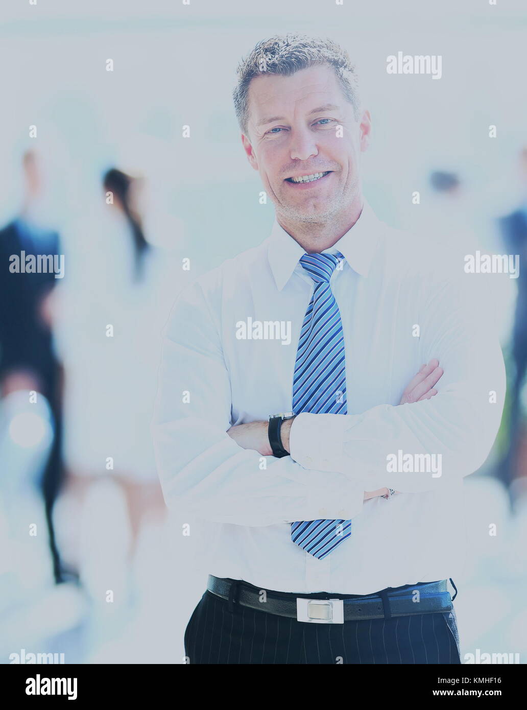 Smiling businessman in his office Stock Photo - Alamy