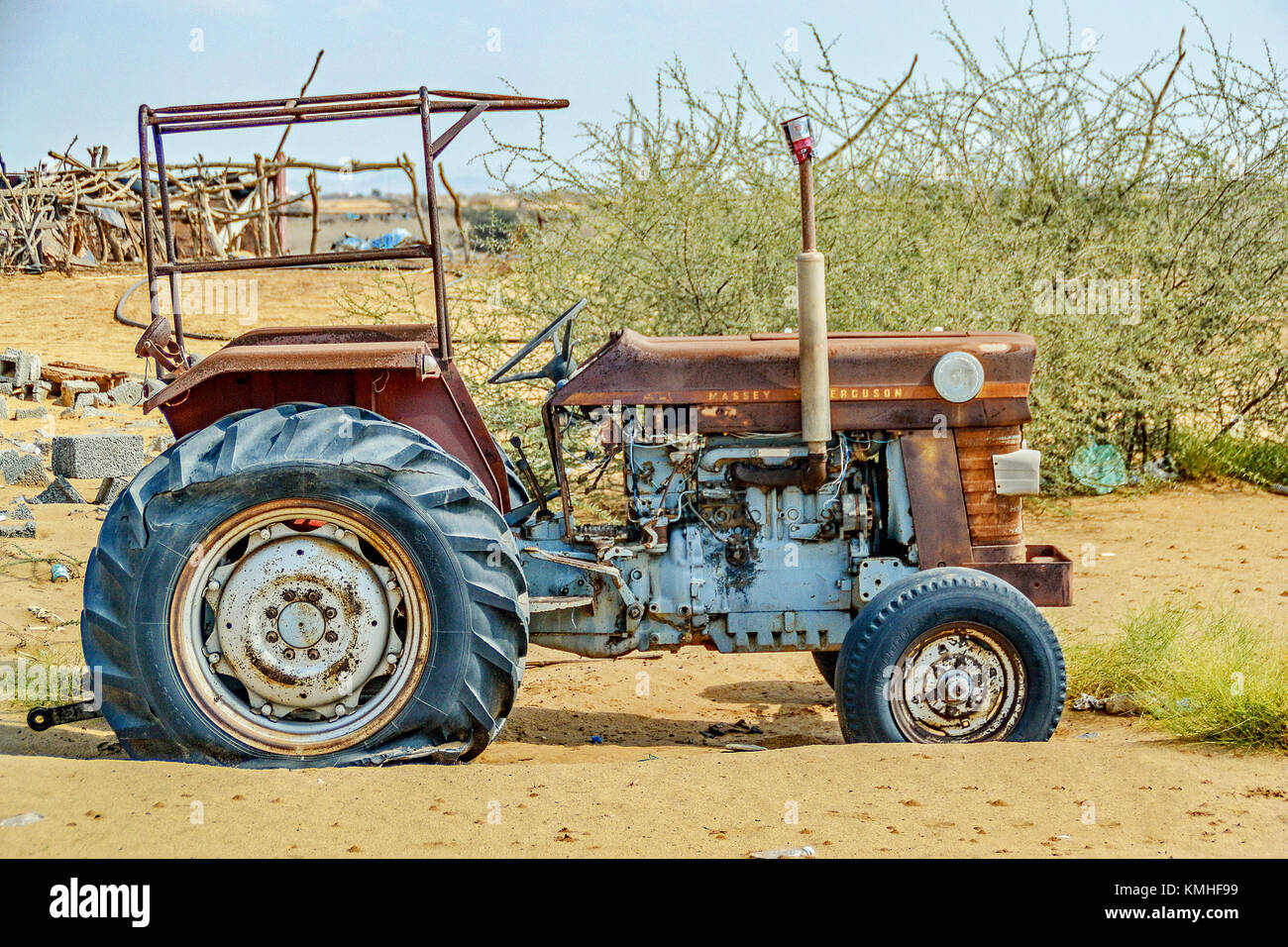 Rusted tractor abandoned in the Saudi desert south of Jeddah at Qunfudaha. Stock Photo