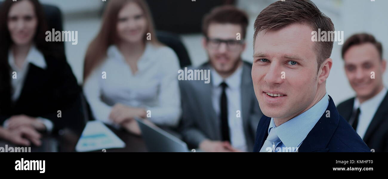 Portrait of an handsome businessman in front of his team Stock Photo ...