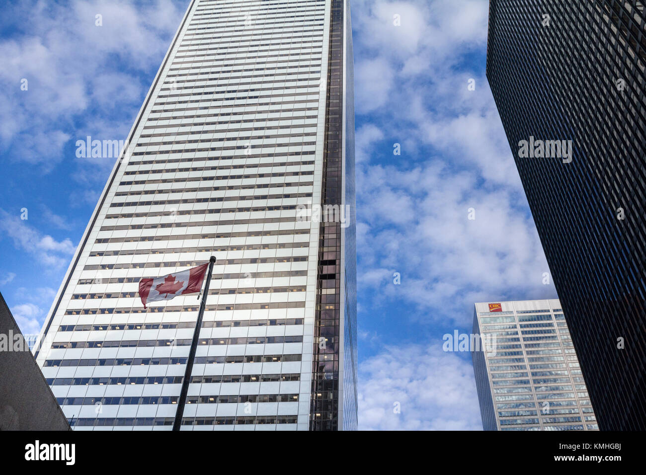 TORONTO, CANADA - DECEMBER 20, 2016: CIBC Headquarters in the center of Toronto, surrounded by skyscrapers and a Canadian flag. The Canadian Imperial  Stock Photo