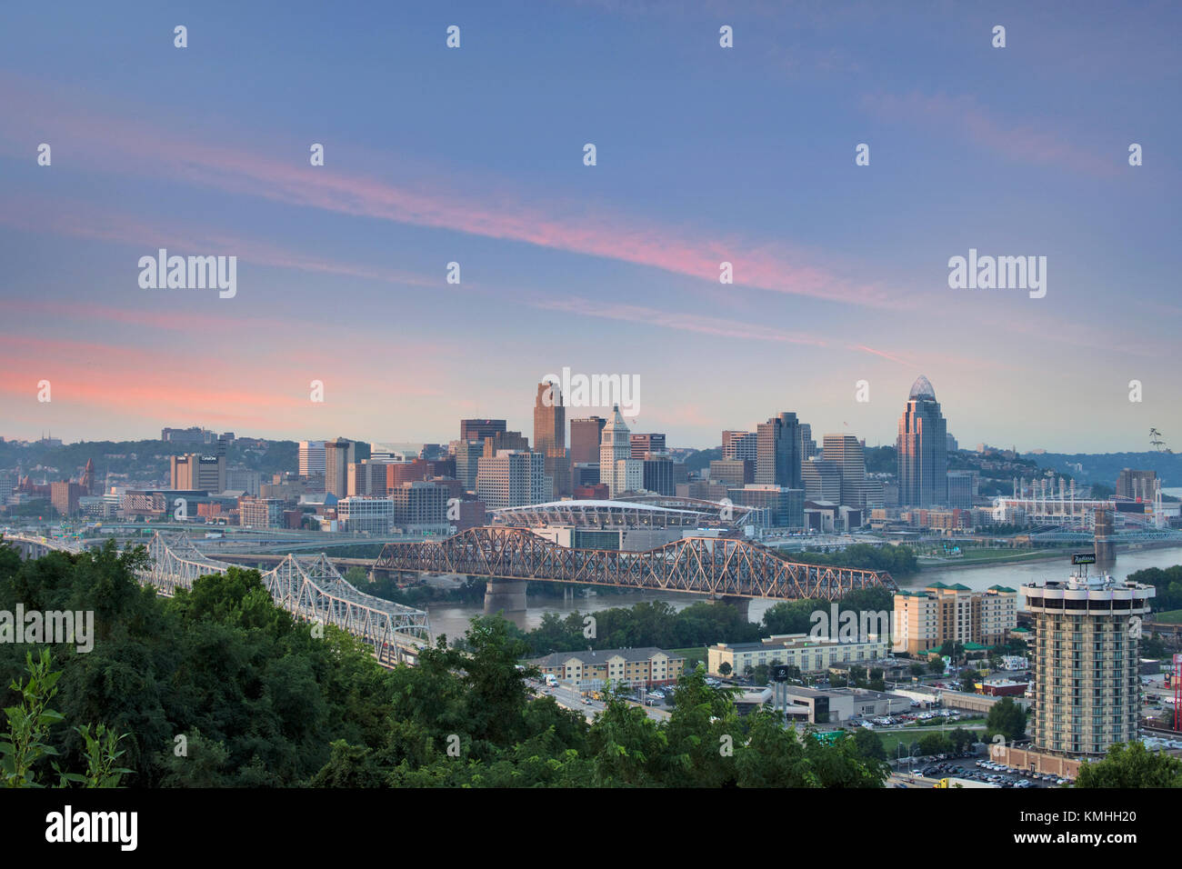 Colorful Sunset over a Skyline of Cincinnati, Ohio from Devou Park in Kenton Hills, Kentucky from Across the Ohio River Stock Photo