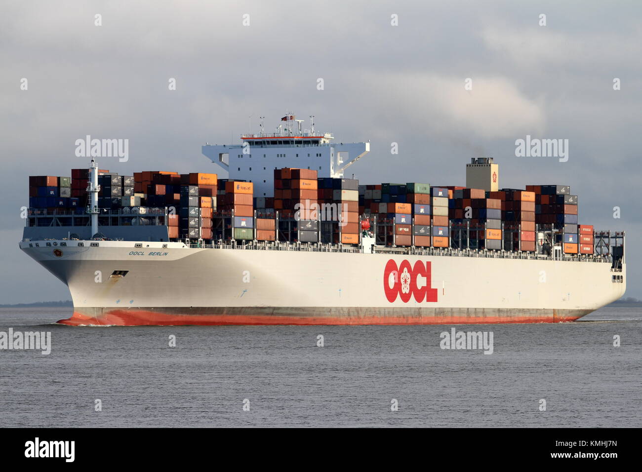 The container ship OOCL Berlin passes on December 28, 2013 Cuxhaven and continues into the North Sea. Stock Photo