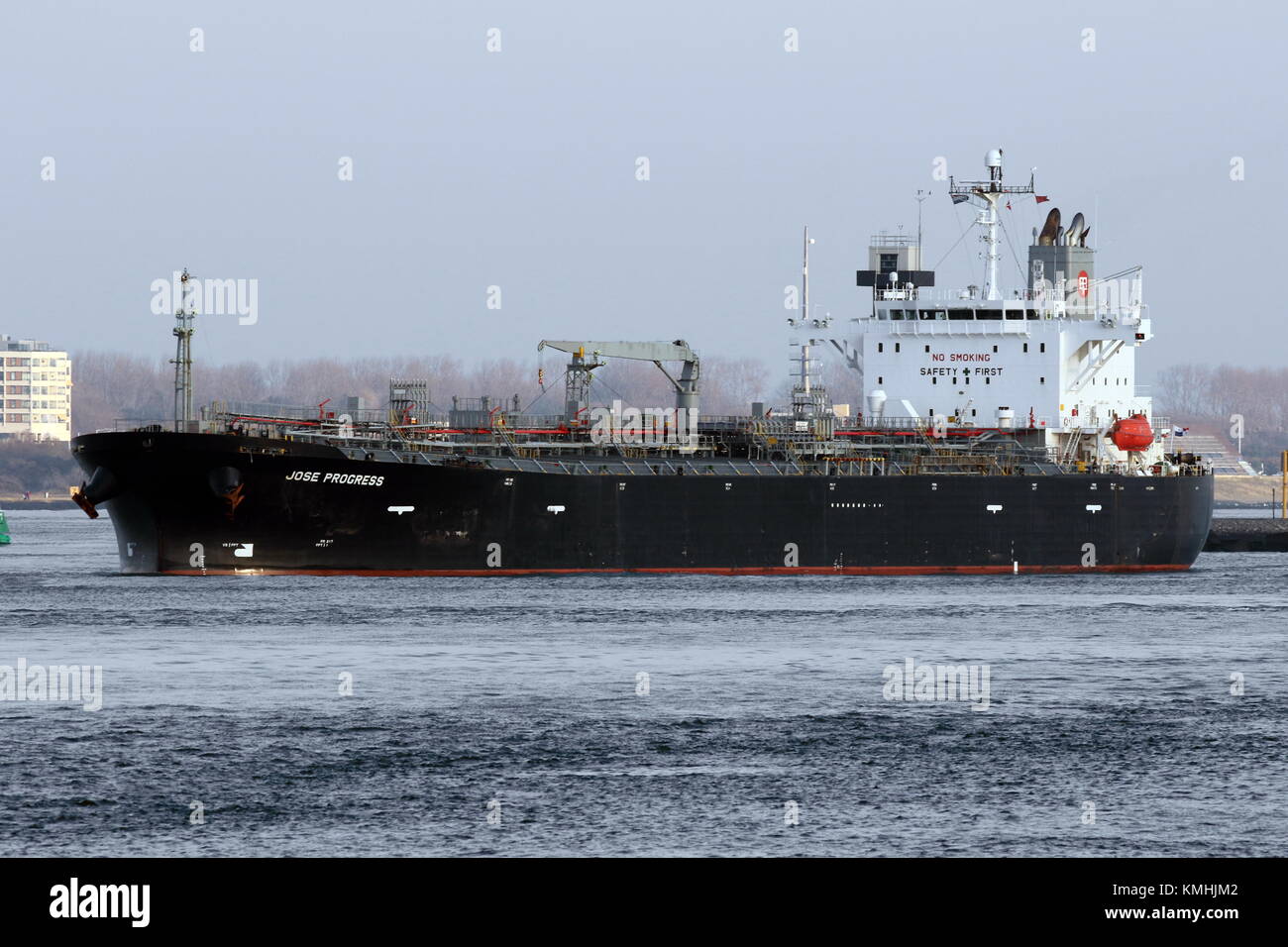 The tanker Jose Progress leaves the port of Rotterdam. Stock Photo