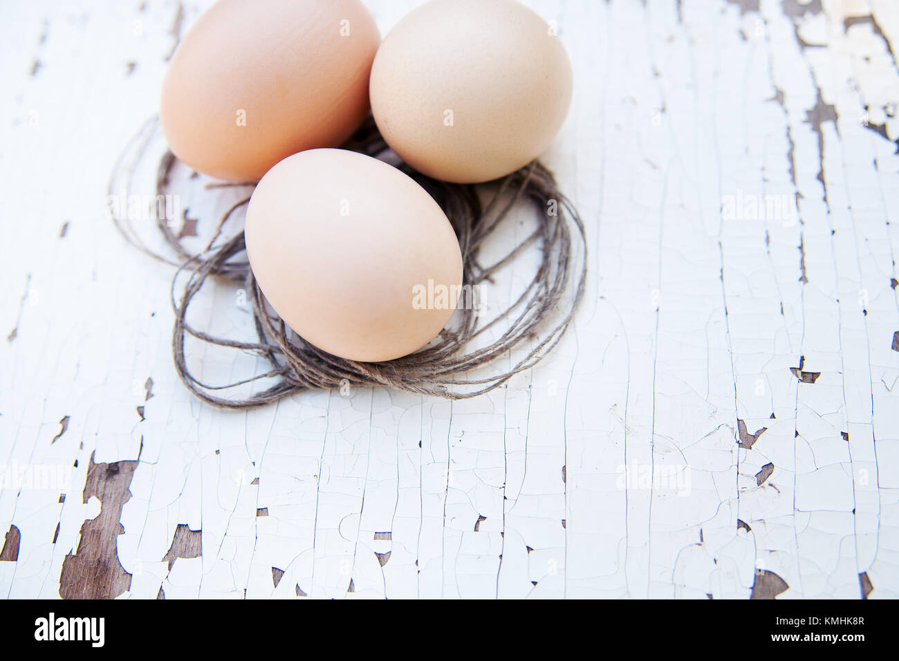 A Chicken eggs on white wooden table Stock Photo - Alamy