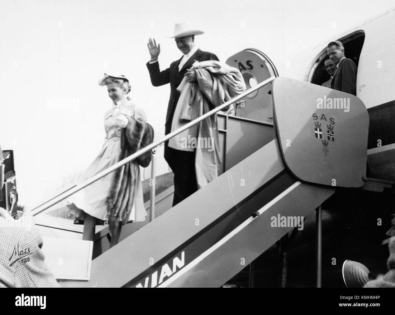 William Boyd, a notable figure, is pictured with his wife. He was known for his career in acting or another professional field. The image likely captures a moment of personal or public significance for the couple. Stock Photo