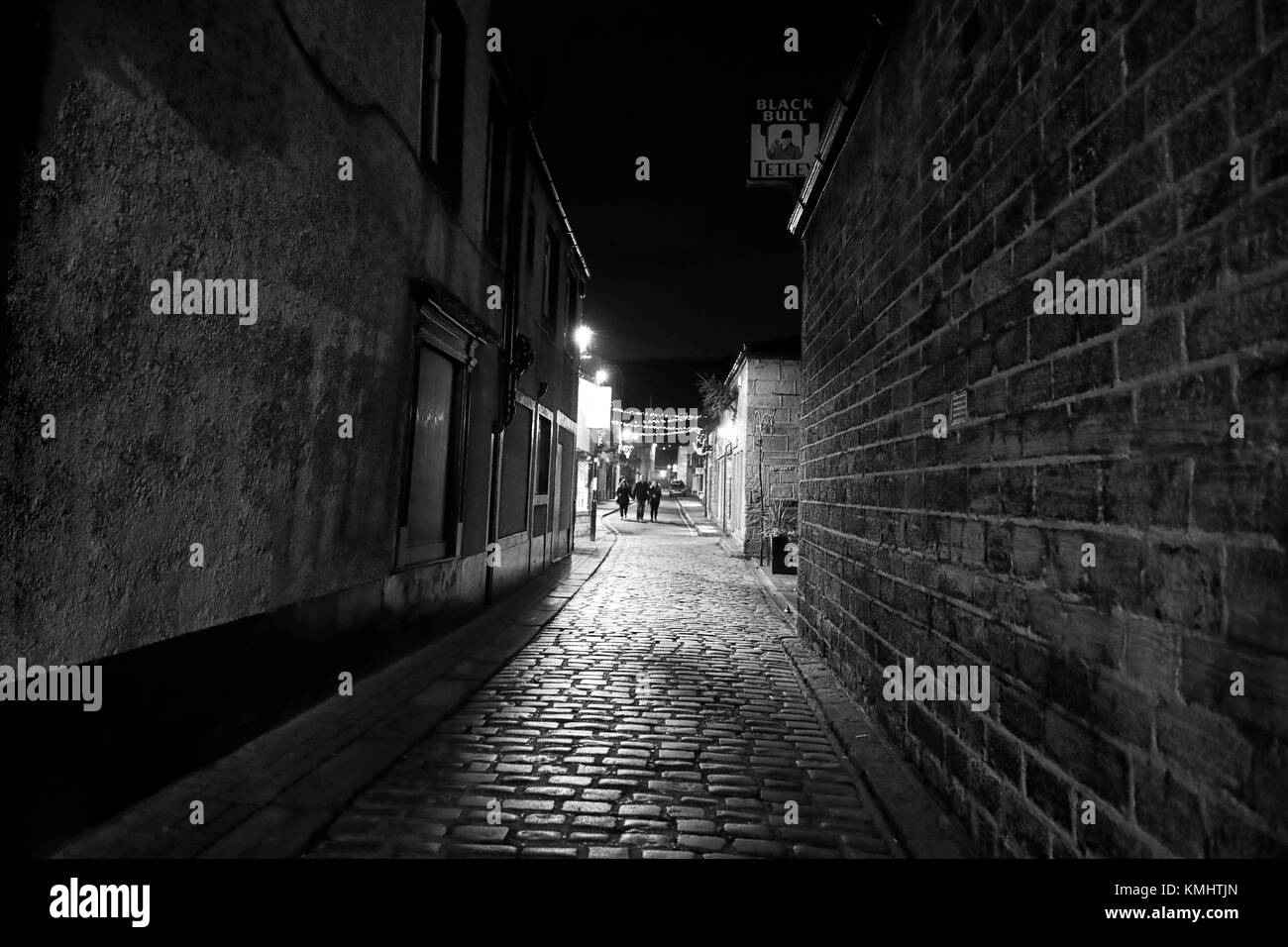 Illuminated cobbles of Black Bull yard and Newmarket Otley, a night scene showing the Christmas lights along Newmarket Stock Photo