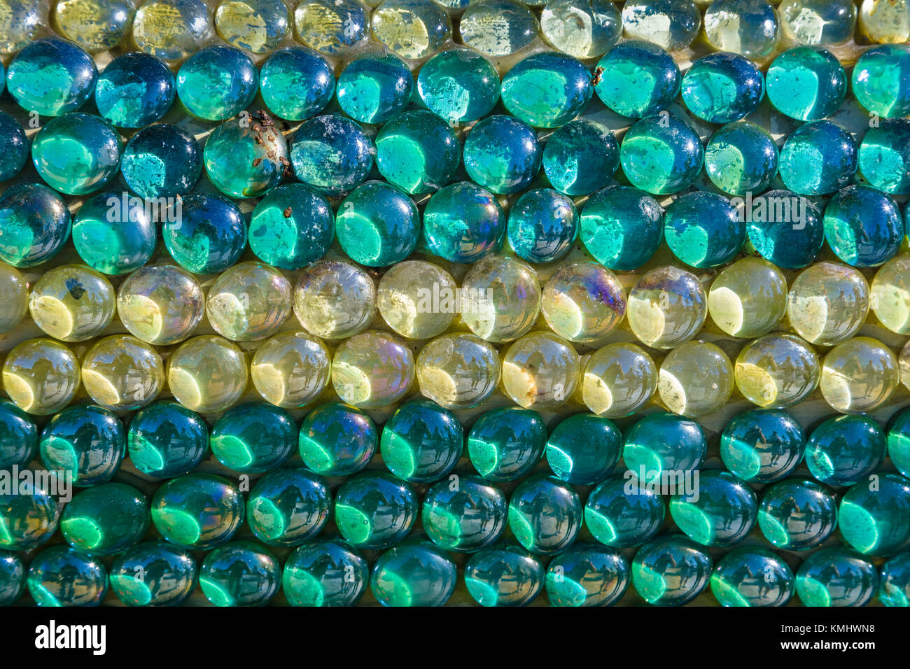 Closeup of aqua and white glass beads filling frame Stock Photo