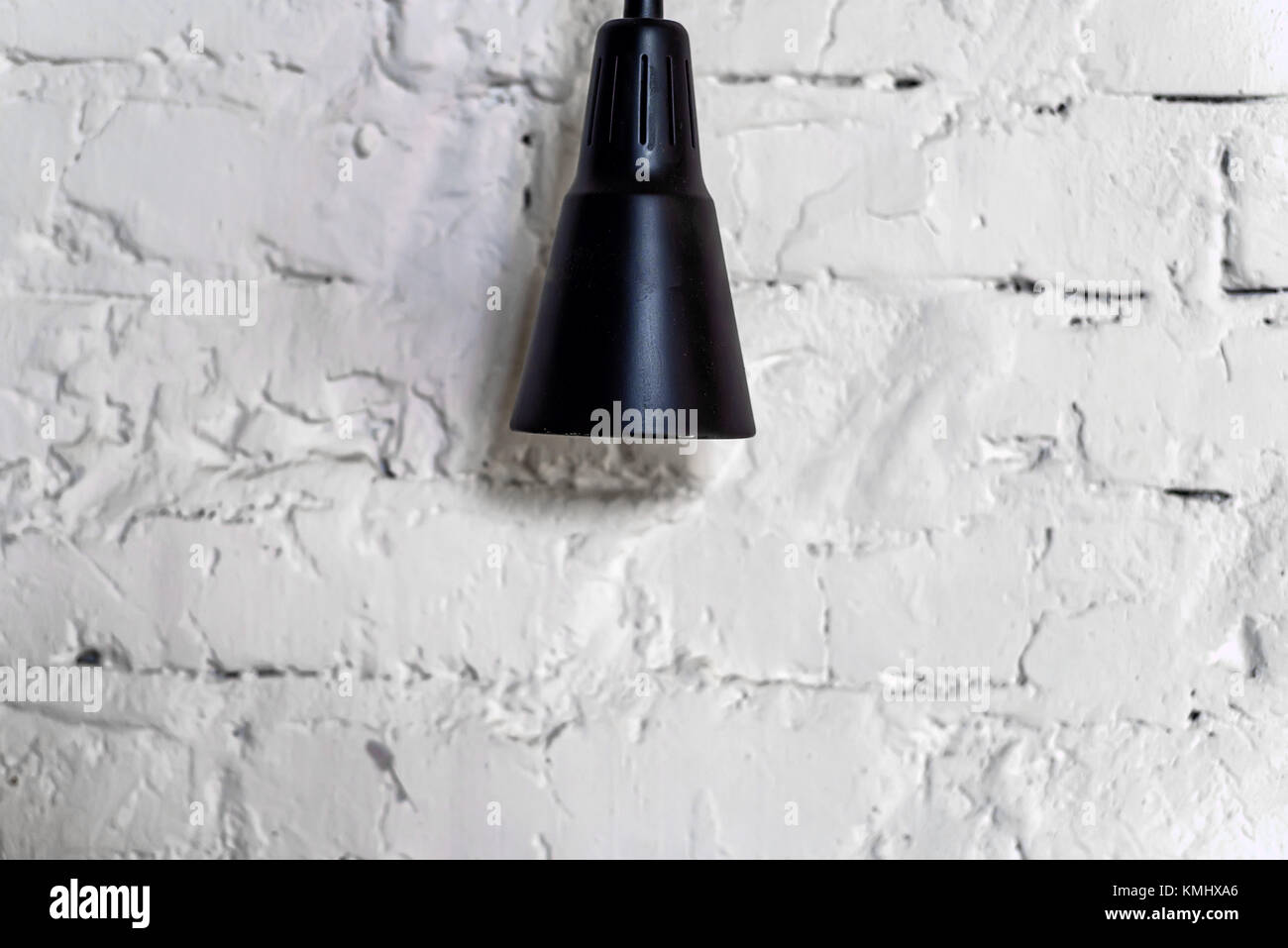 Modern stylish black lamp hangs from ceiling Stock Photo Alamy