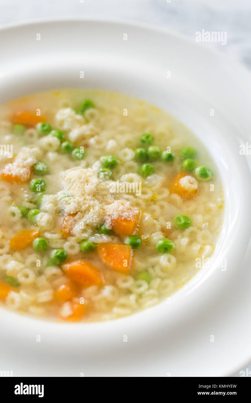 Italian chicken pasta soup with parmesan Stock Photo