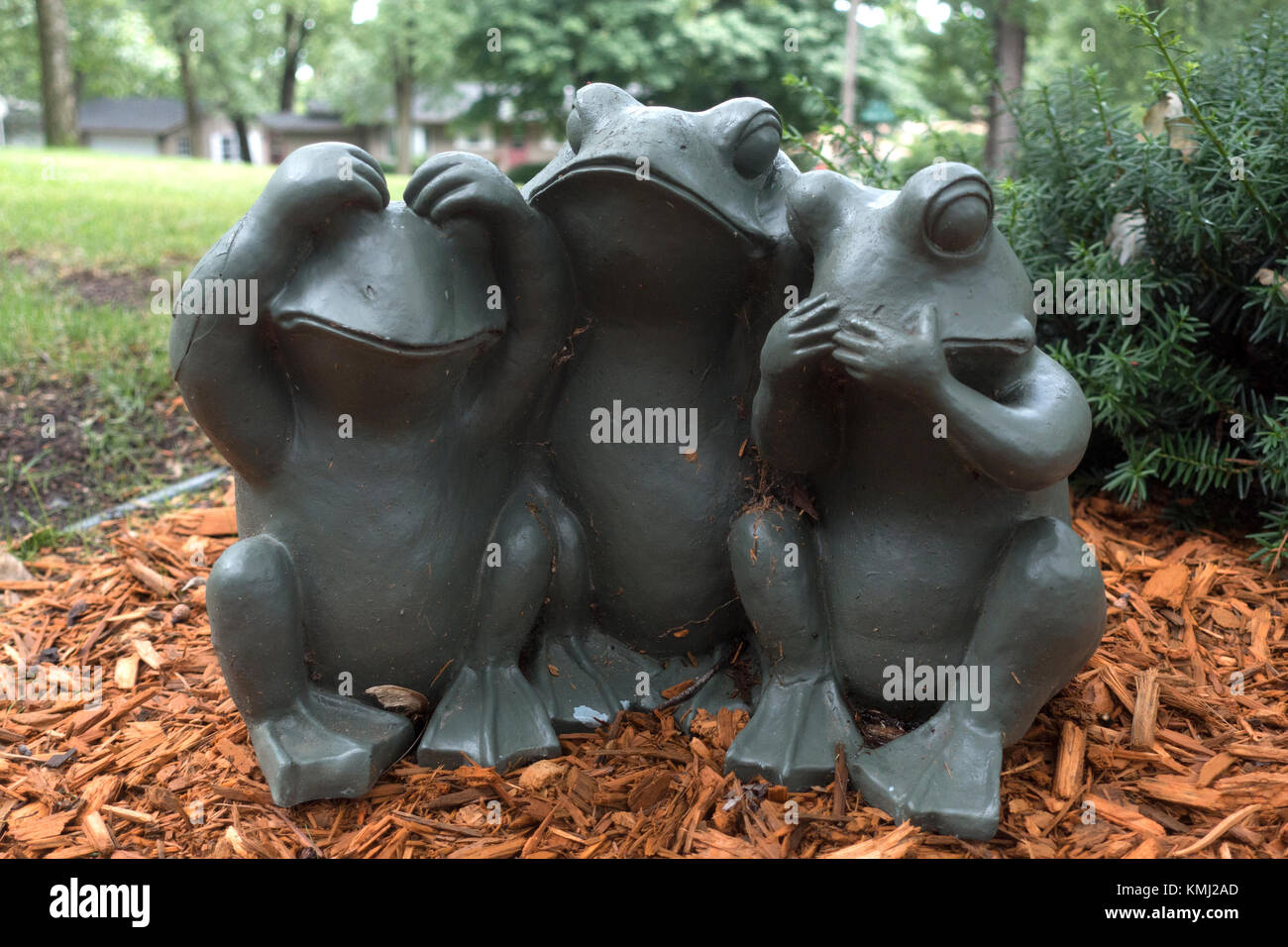 See no evil, hear no evil, speak no evil, frog residential lawn sculpture. Bloomington Minnesota MN USA Stock Photo