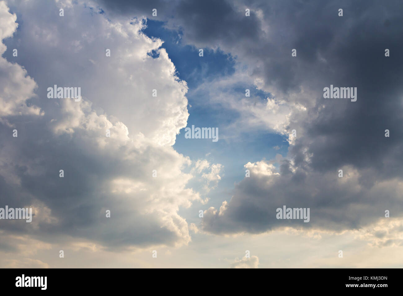 Dark clouds on blue sky background Stock Photo - Alamy