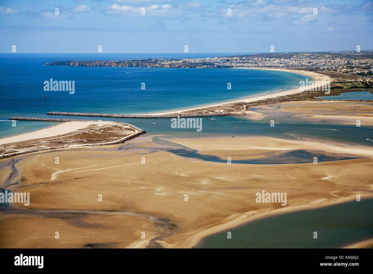 In the foreground Alvor estuary, Natural Reseve. In the background Meia  praia beach, Lagos and Ponta da Piedade, Faro district. Algarve, Portugal  Stock Photo - Alamy