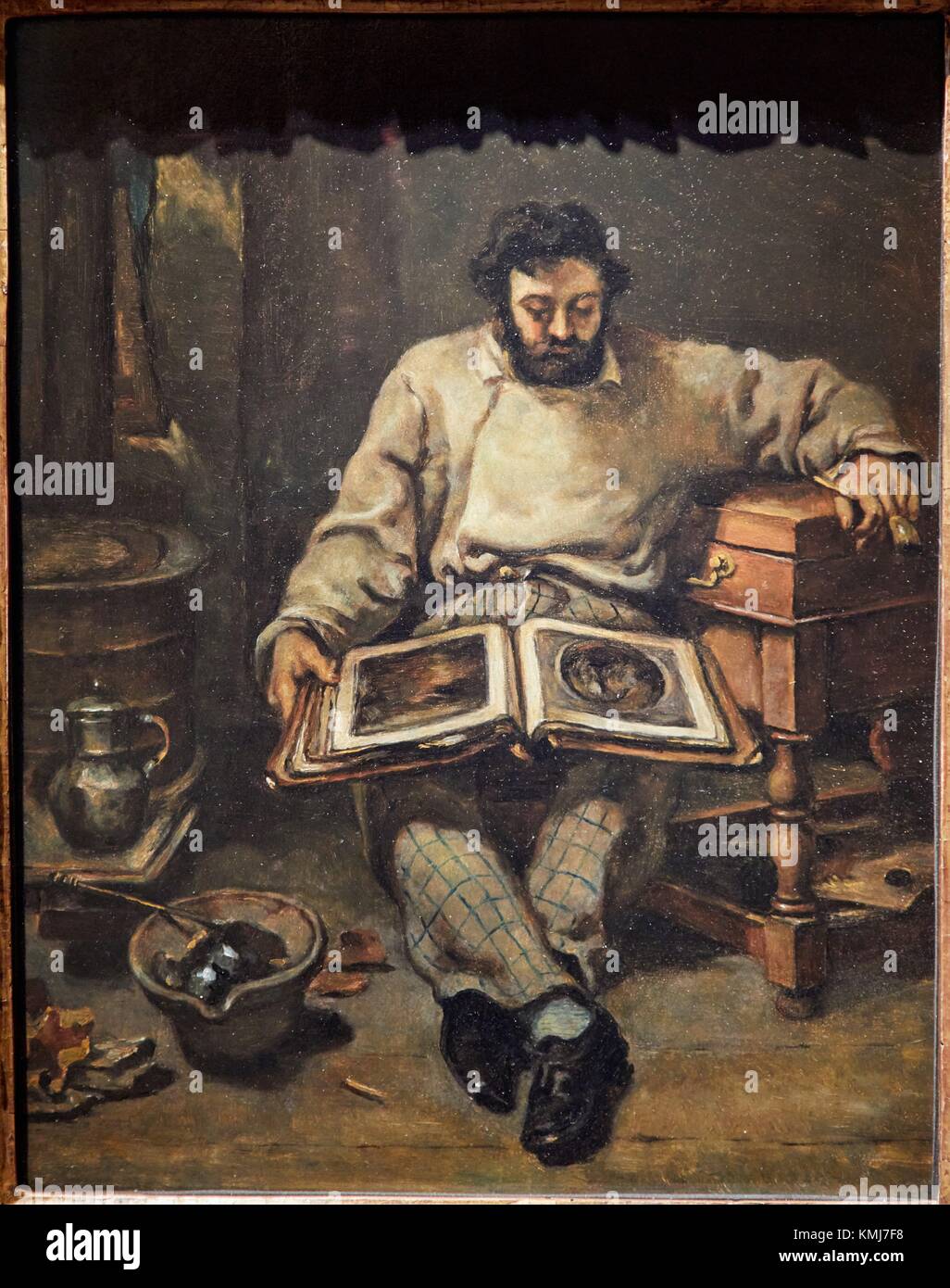 Marc Trapadoux Examining a Book of Prints, Gustave Courbet, 1849, Musée d'Art Moderne, Troyes, Champagne-Ardenne Region, Aube Department, France, Stock Photo