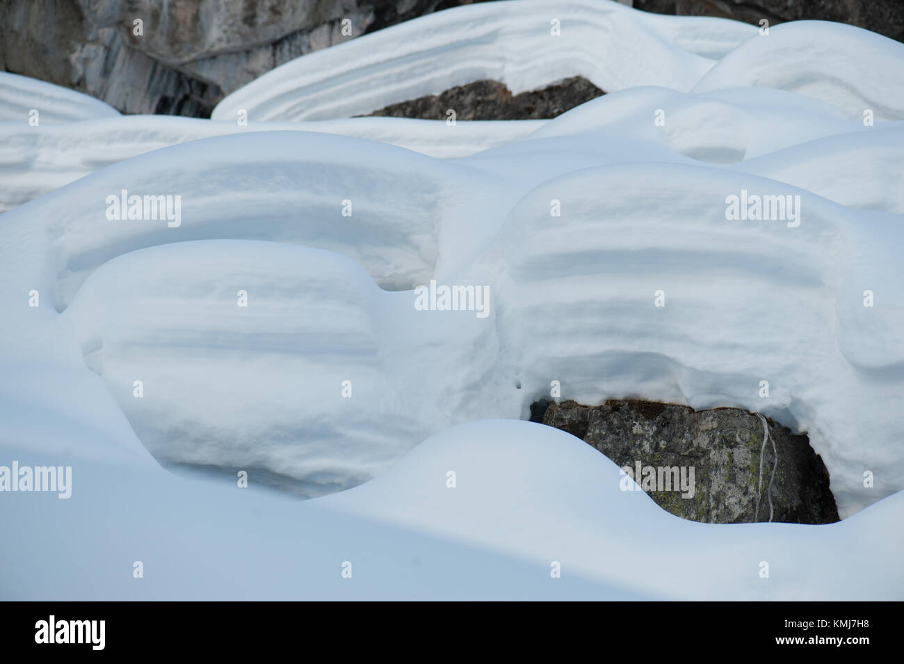 High snow on the mountain rocks. Pont, Valsavarenche. Aosta, Valle d'Aosta. Italy. Stock Photo