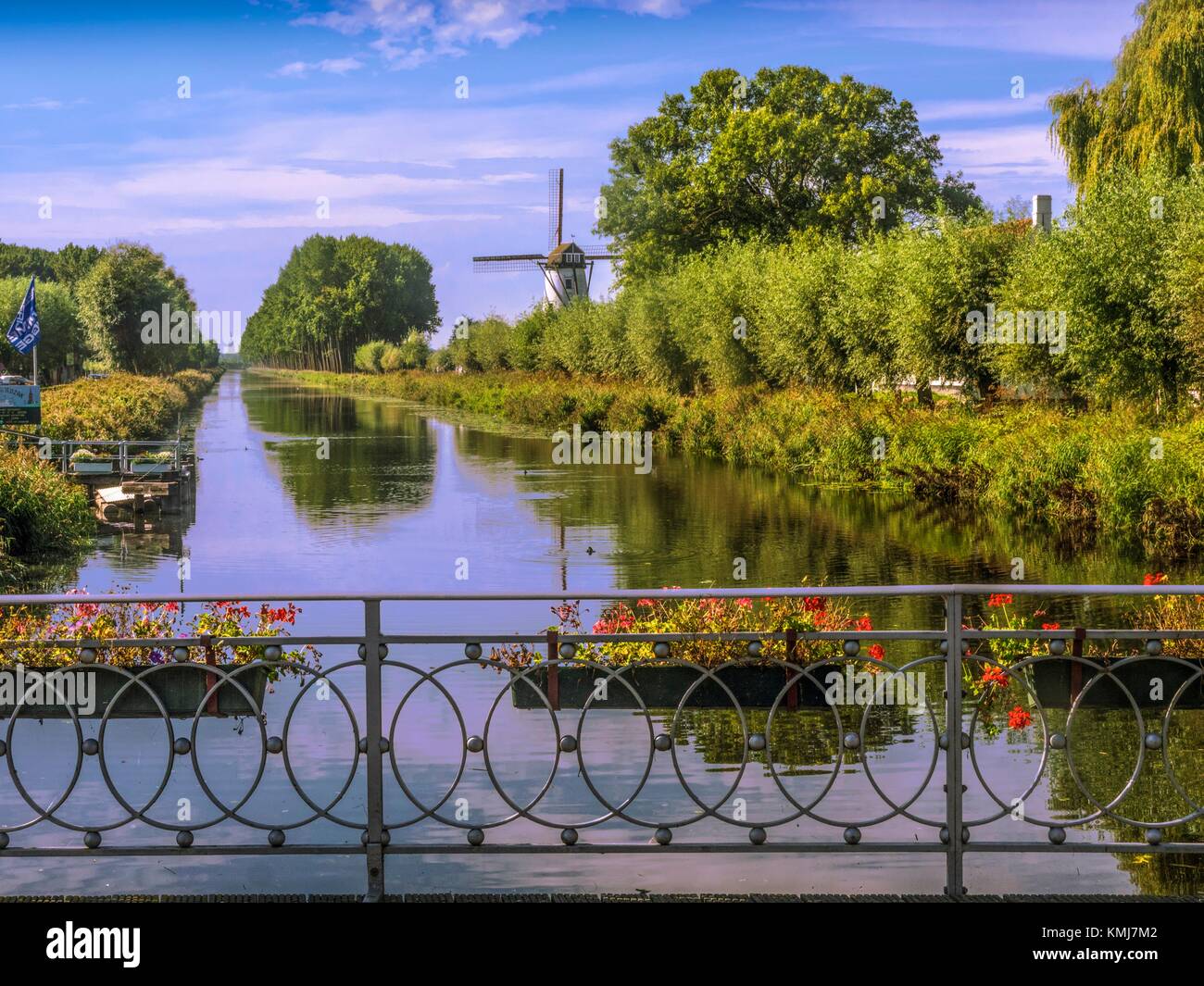 Belgium, Brugges, Windmill by the canal at Damme. Stock Photo