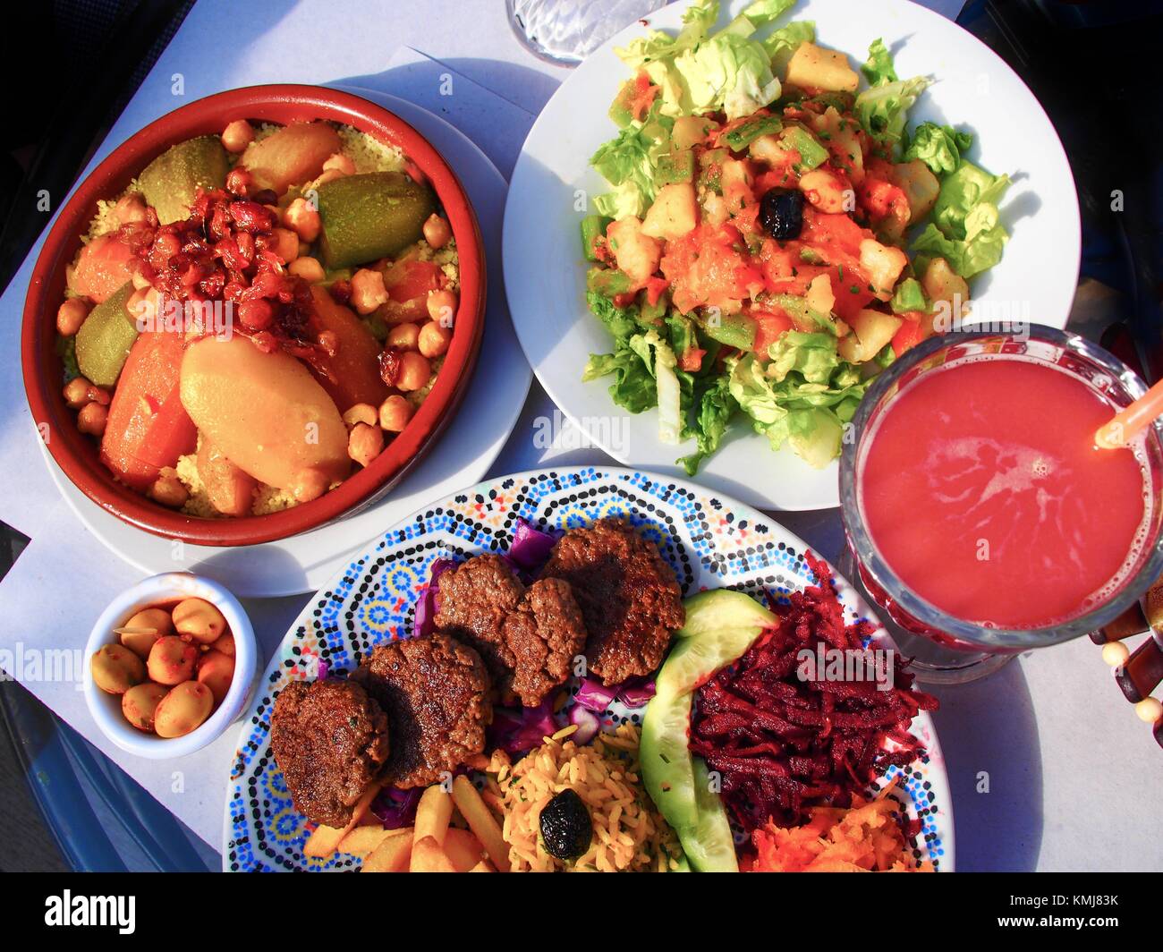 Morocco, Food, Couscous,olives, ''Kefta'' meat, moroccan salad, and grenade fruit juice. Stock Photo