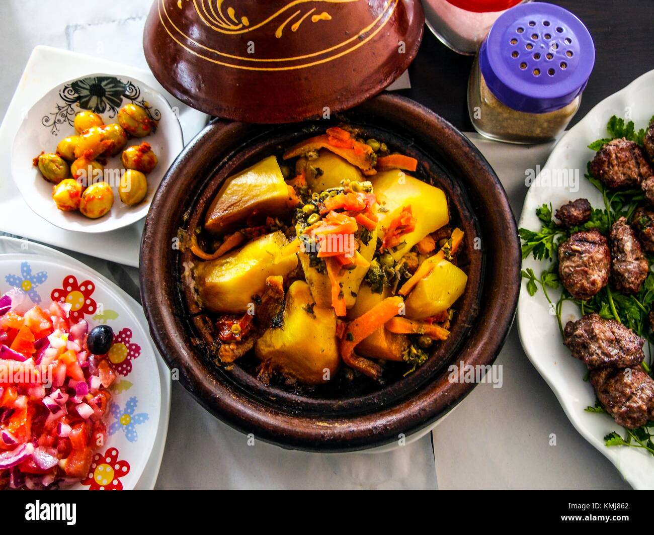 Morocco, Food, Moroccan salad, pickled olives, vegetable ''tagine'' (stew) and grilled ''Kefta'' (minced meat). Stock Photo