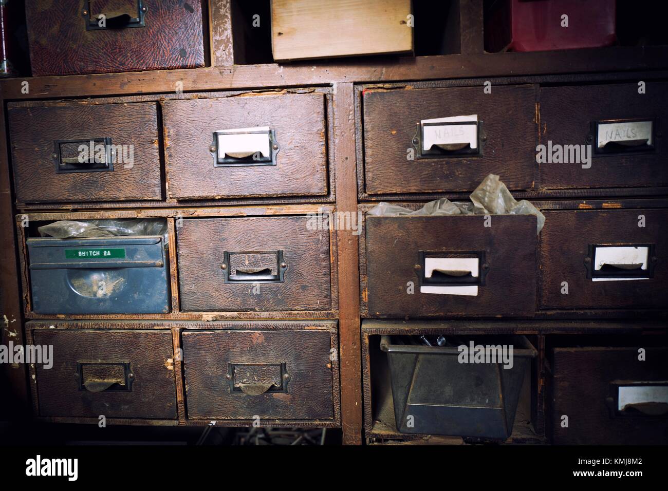 Vintage filing cabinet with wooden drawers in a carpentry workshop. Keighley, Bradford, West Yorkshire, UK. Stock Photo