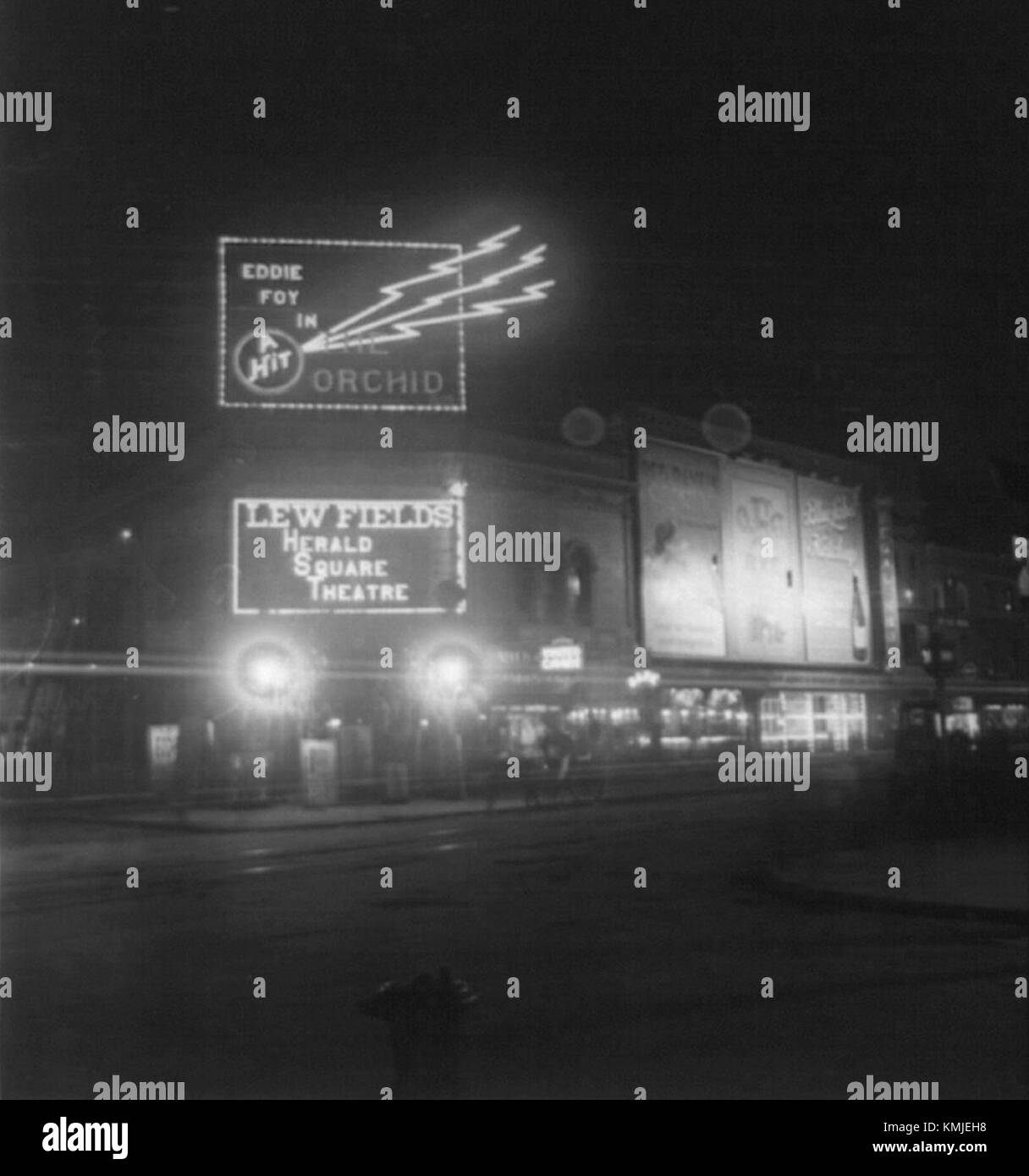 The Herald Square Theatre in New York City illuminated at night, showcasing its historic architecture and vibrant marquee. Stock Photo