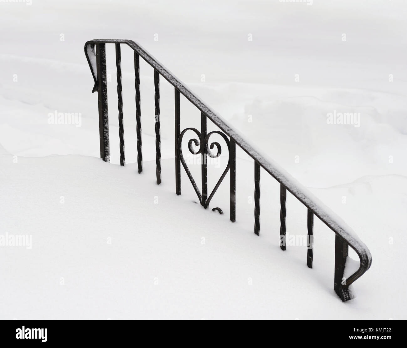 Wrought iron railing covered in snow. Winter background Stock Photo