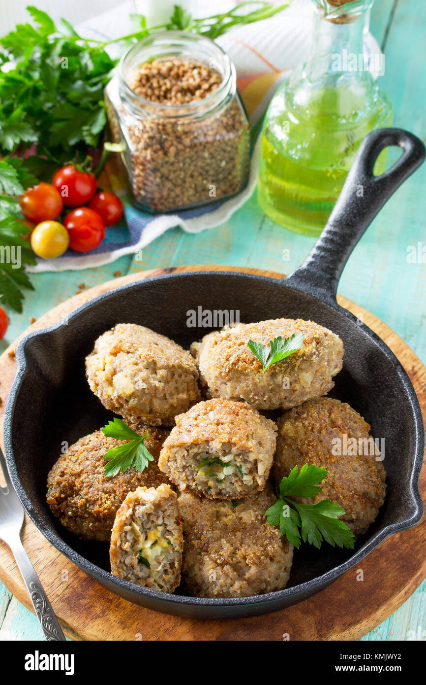 Homemade meatballs with buckwheat and egg stuffing. Castiron frying